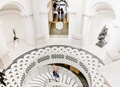 tate britain person walking upstairs inside building staircase